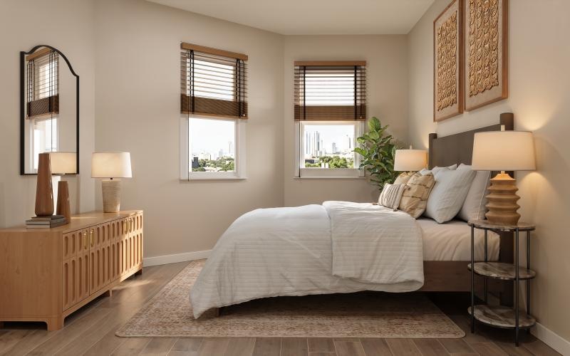 a bedroom with a bed and lamps