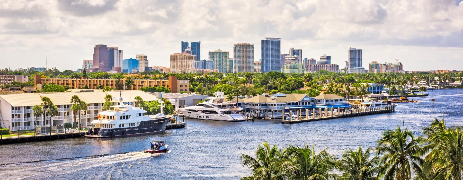 a body of water with boats and buildings in the background